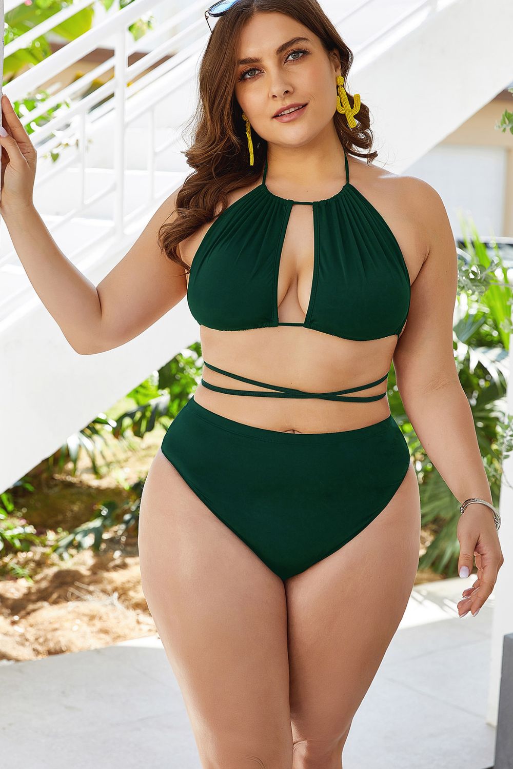Green halter bikini with keyhole cutout top and high-waist bottoms.