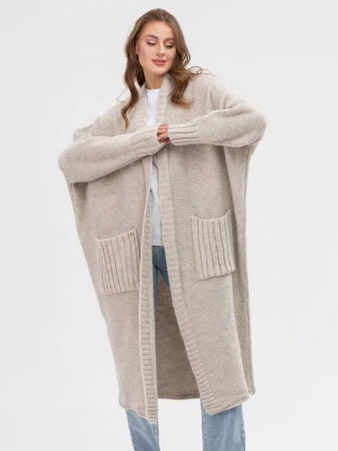 Oversized knit cocoon cardigan in Khaki with ribbed pockets and wide sleeves.
