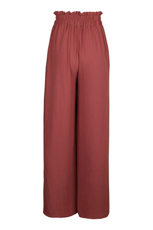 Ruffled waist palazzo trousers in rust, wide leg cut.