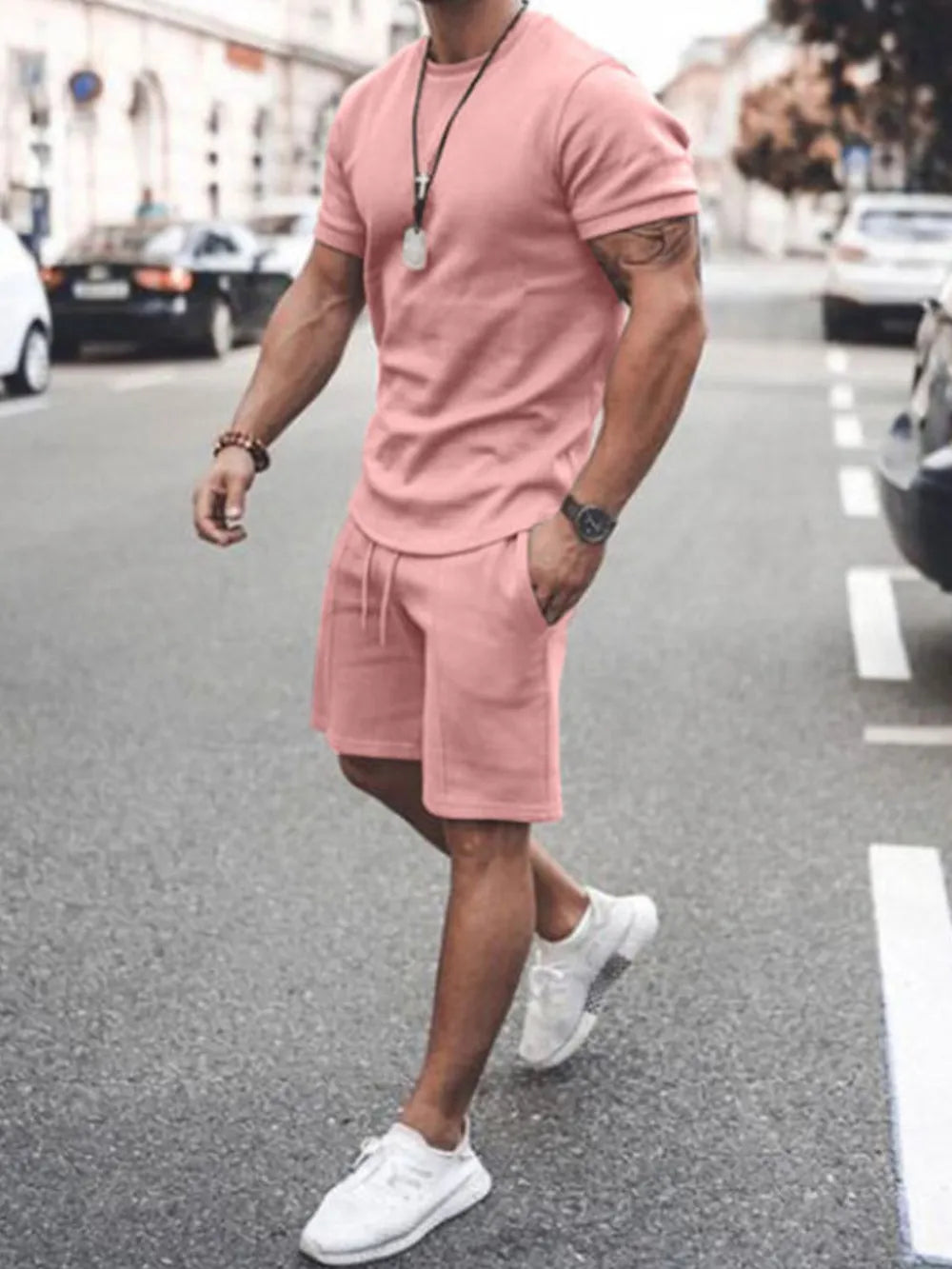 Men's dusty pink short sleeve t-shirt and drawstring shorts co-ord set.