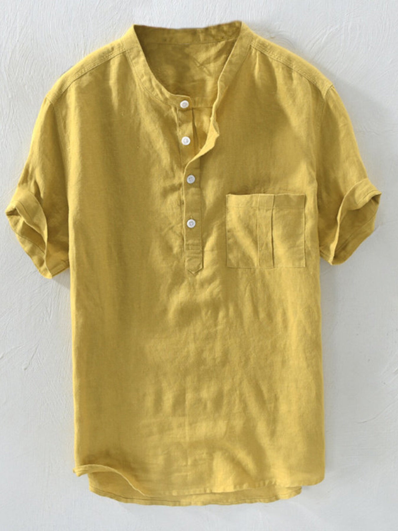 Yellow band collar casual shirt with short sleeves and a chest pocket.