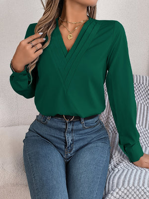 Dark Green V-neck blouse with pleated detail and long sleeves.