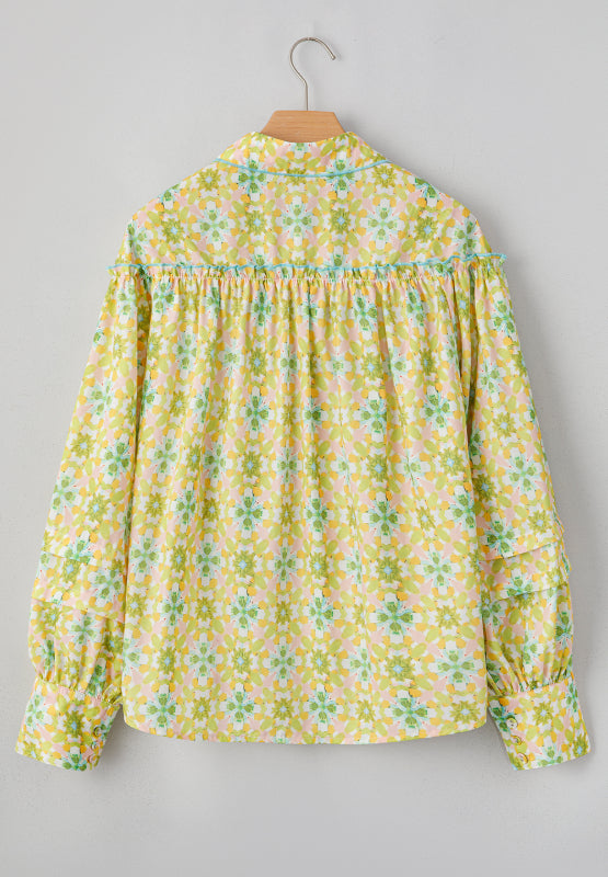 Yellow green floral ruffle yoke button-down blouse with tiered sleeves.