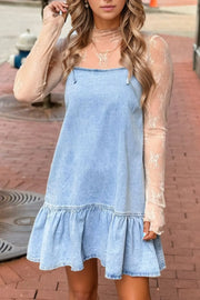 Light blue denim sundress with ruffled hem and spaghetti straps, styled with a sheer lace top.