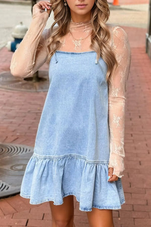 Light blue denim sundress with ruffled hem and spaghetti straps, styled with a sheer lace top.