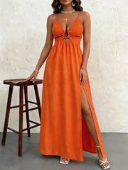 Orange maxi dress with cutout detail, gold hardware, spaghetti straps, and high slit.