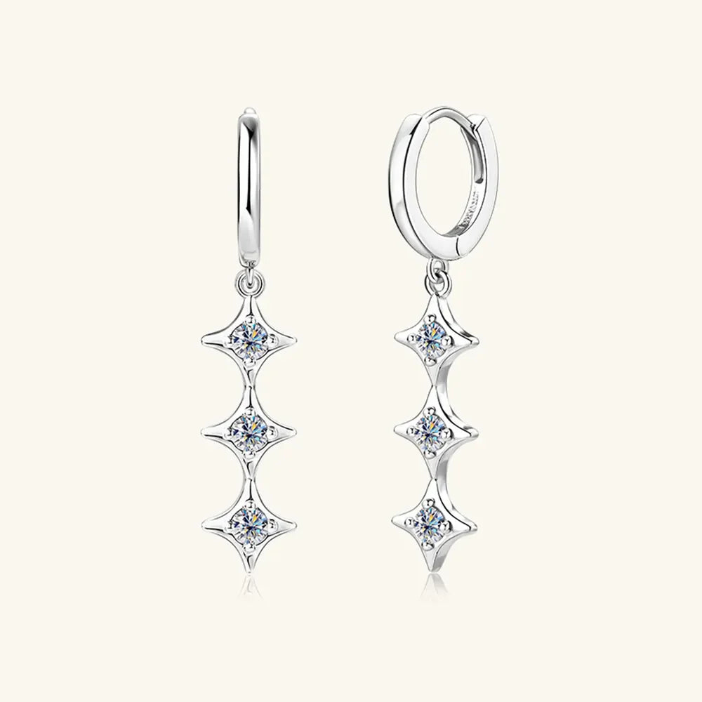 Silver hoop earrings with three cascading star-shaped moissanite charms.