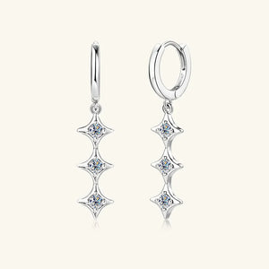 Silver hoop earrings with three cascading star-shaped moissanite charms.