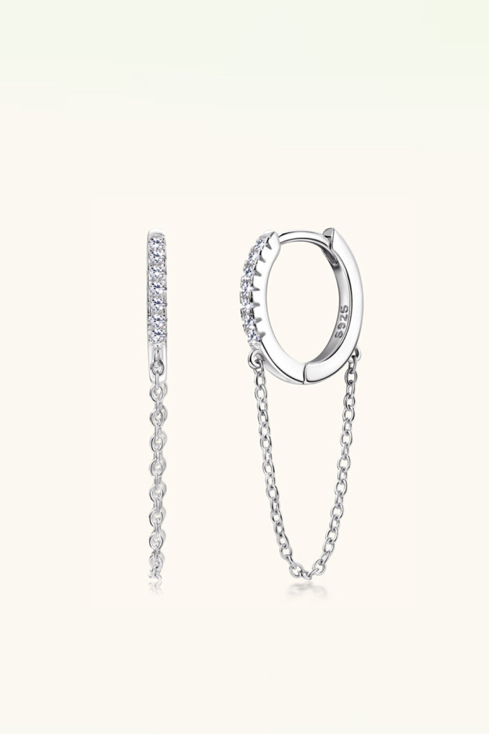 Silver pavé chain huggie earrings with delicate dangling chains.