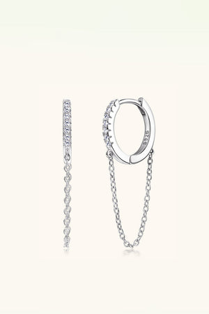 Silver pavé chain huggie earrings with delicate dangling chains.