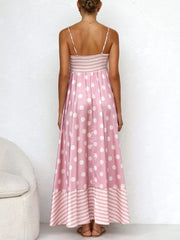 Blush pink polka dot maxi dress with spaghetti straps, smocked bodice, and striped hem.