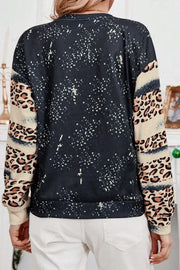 Black sweatshirt with leopard print sleeves and splatter detail