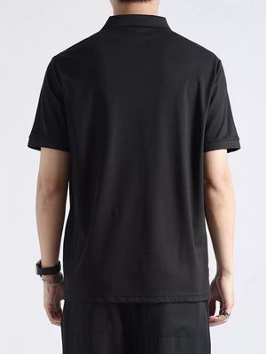 Black textured casual polo shirt with button accents, short sleeves, and a classic collar.