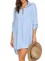 Sky blue oversized collared polyester shirt with roll-tab sleeves and a deep V-neck.
