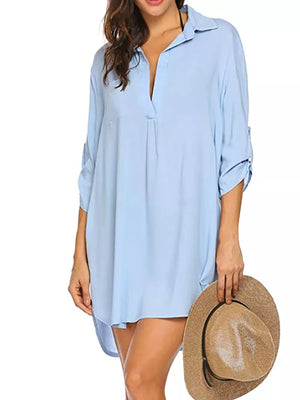 Sky blue oversized collared polyester shirt with roll-tab sleeves and a deep V-neck.