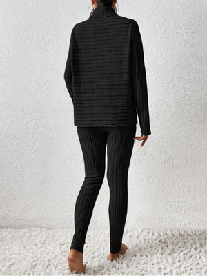 Black textured turtleneck loungewear set with ribbed leggings.