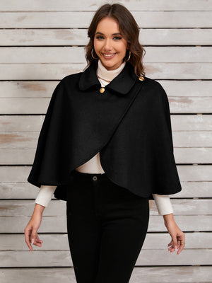 Black asymmetric button-front cape jacket with gold buttons and a collar.