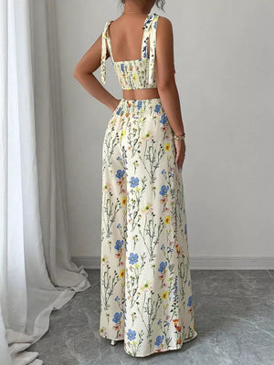 Floral print crop top and wide-leg pants set with adjustable tie straps.