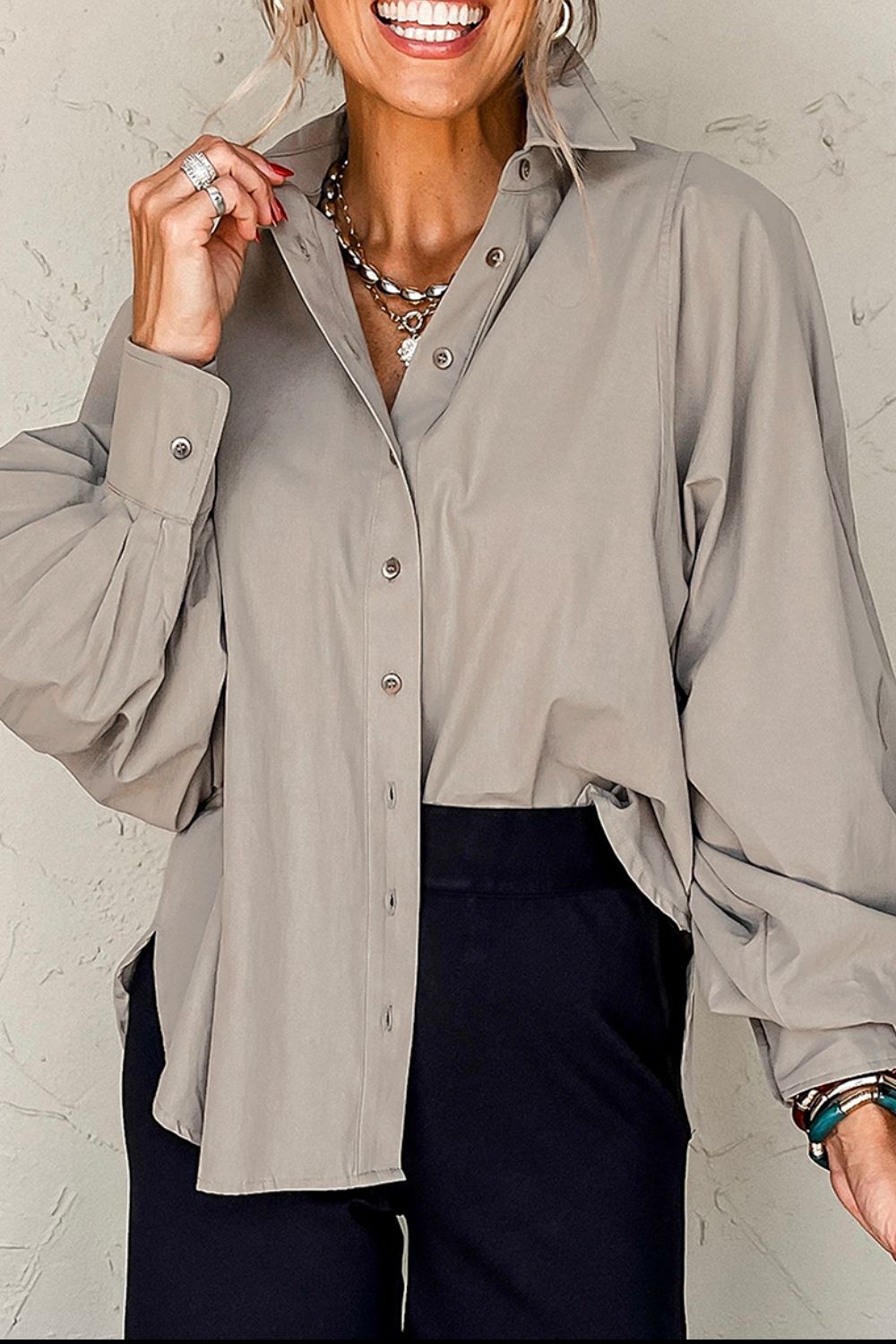 Light gray balloon sleeve button-down blouse with button cuffs and a collared neckline.