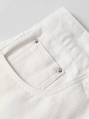 White relaxed fit wide leg sweatpants with silver button details on the pocket.