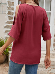 Burgundy open-shoulder textured raglan top with cold shoulder sleeves and a casual fit.
