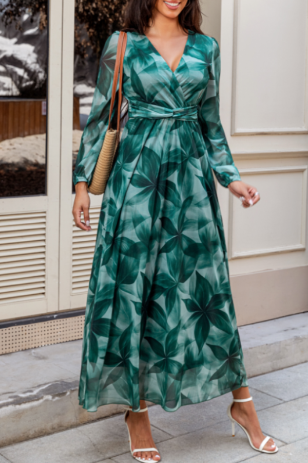 V-neck wrap maxi dress in green botanical print with long sleeves and a tie waist.
