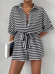 Black and white striped shirt romper with self-tie belt and button front.