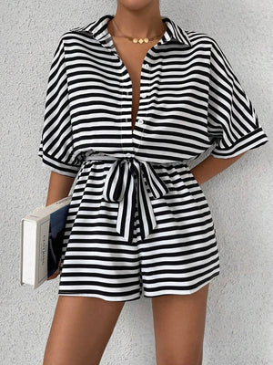 Black and white striped shirt romper with self-tie belt and button front.