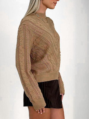 Camel textured chevron knit pullover sweater with bobble details and open knit panels.