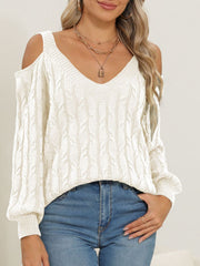 Ivory cable knit cold shoulder sweater with V-neck and balloon sleeves.