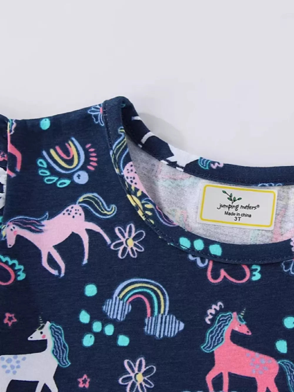 Navy cotton baby dress with unicorn and rainbow print, ruffle sleeves.