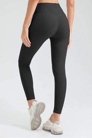 Black high rise leggings with a seamless V-cut back detail.