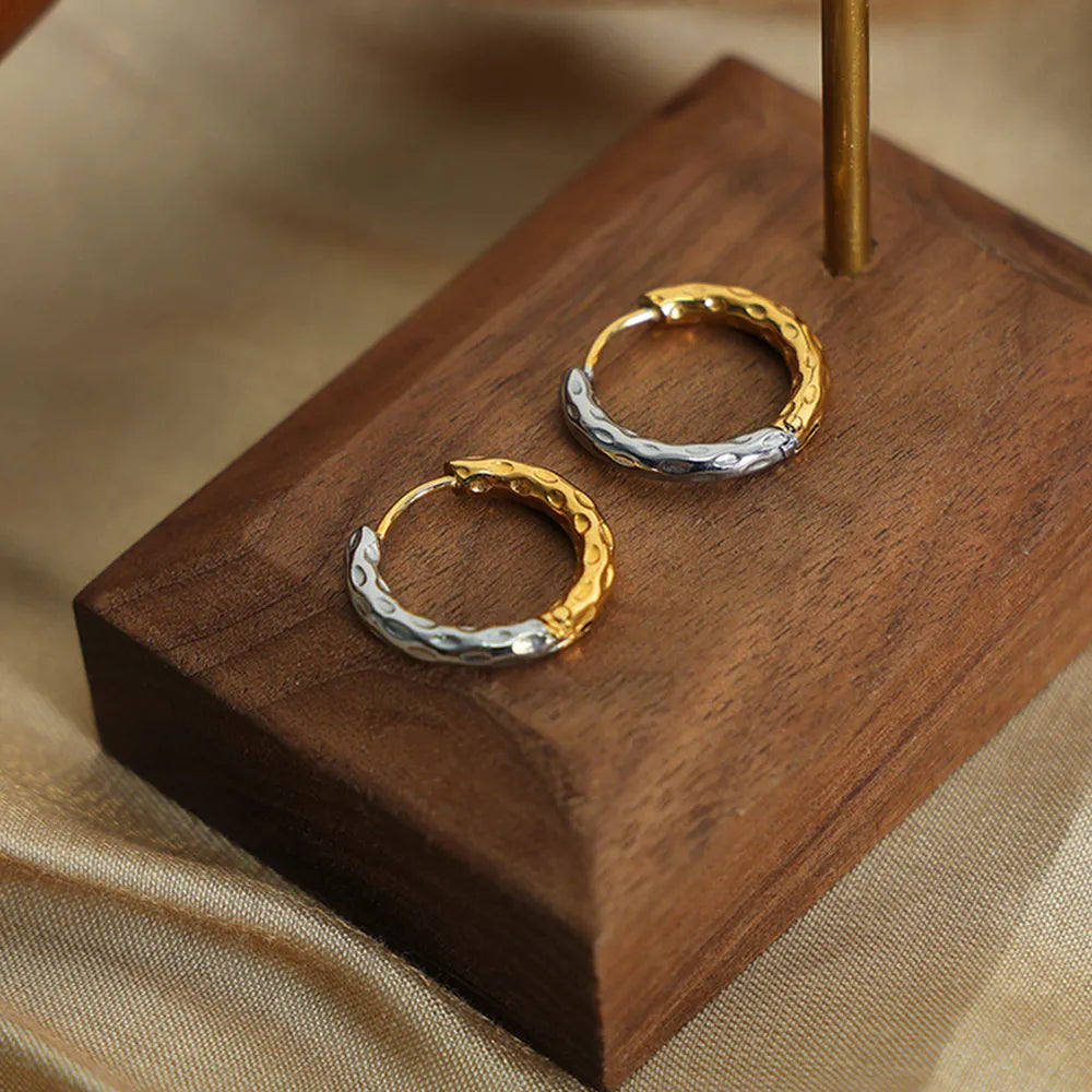 Textured two-tone huggie hoop earrings in gold with hammered detail