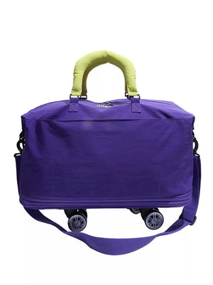 Vibrant purple travel bag with neon green padded handles and wheels.