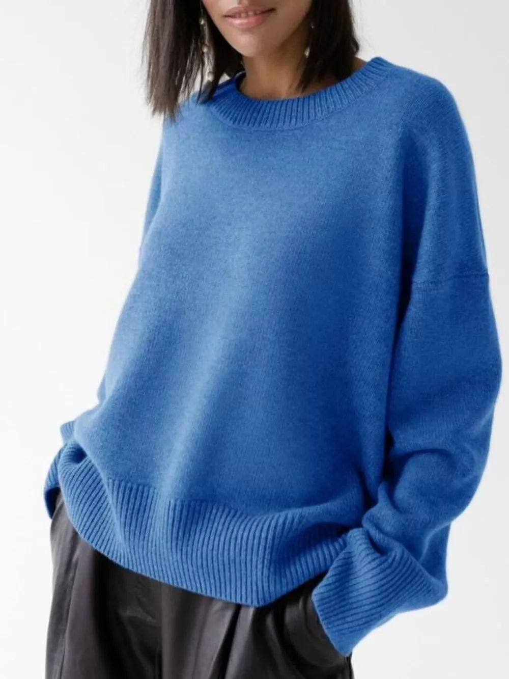 Soft knit sweater in light blue with ribbed detailing and crew neck.