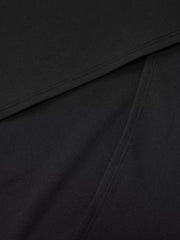 Black maxi dress detail showing seam and fabric texture.