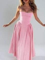Blush pink sweetheart midi dress with spaghetti straps and full pleated skirt