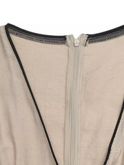 Beige maxi dress with black piping and a zipper detail.