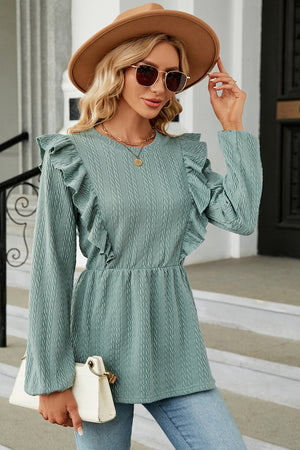 Light blue textured peplum blouse with ruffle details and long sleeves