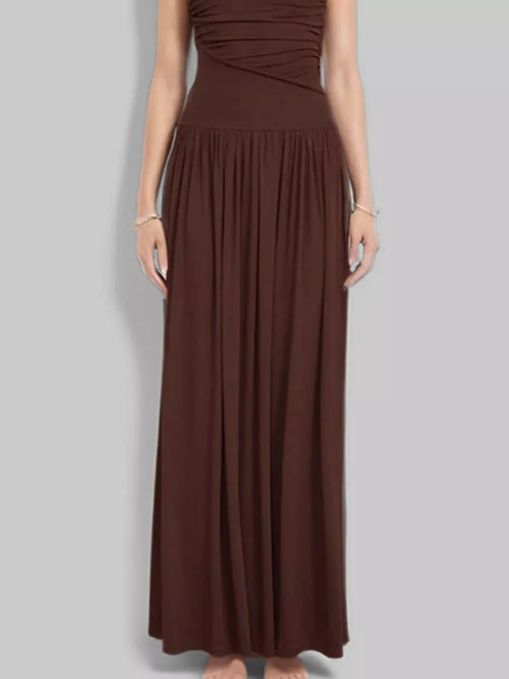 Brown ruched maxi dress with gathered neckline and flowing skirt