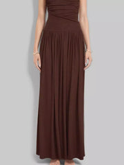 Brown ruched maxi dress with gathered neckline and flowing skirt
