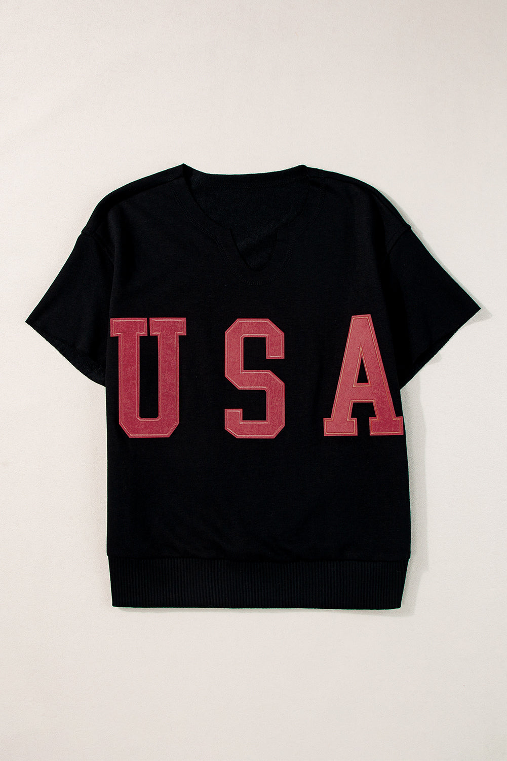 Black sweatshirt with red USA appliqué and V-neckline