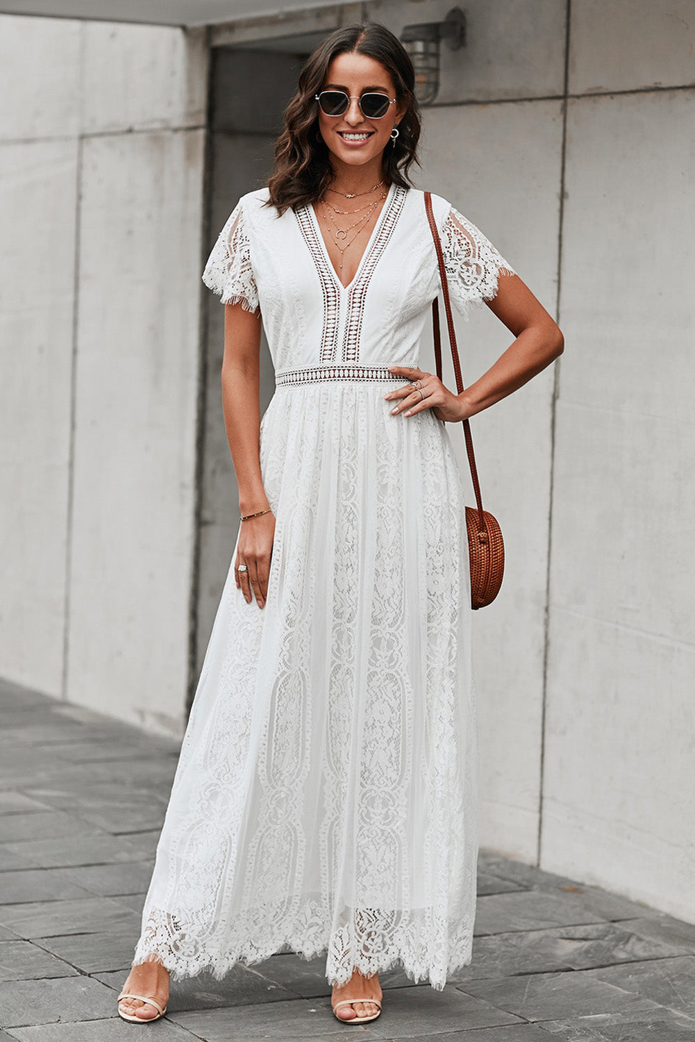 White lace midi dress with scalloped hem and short sleeves.