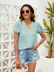 Light green dotted swiss blouse with puff sleeves and lace trim neckline