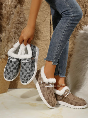 Southwestern print faux fur lined loafers in taupe and gray with white laces and white soles.