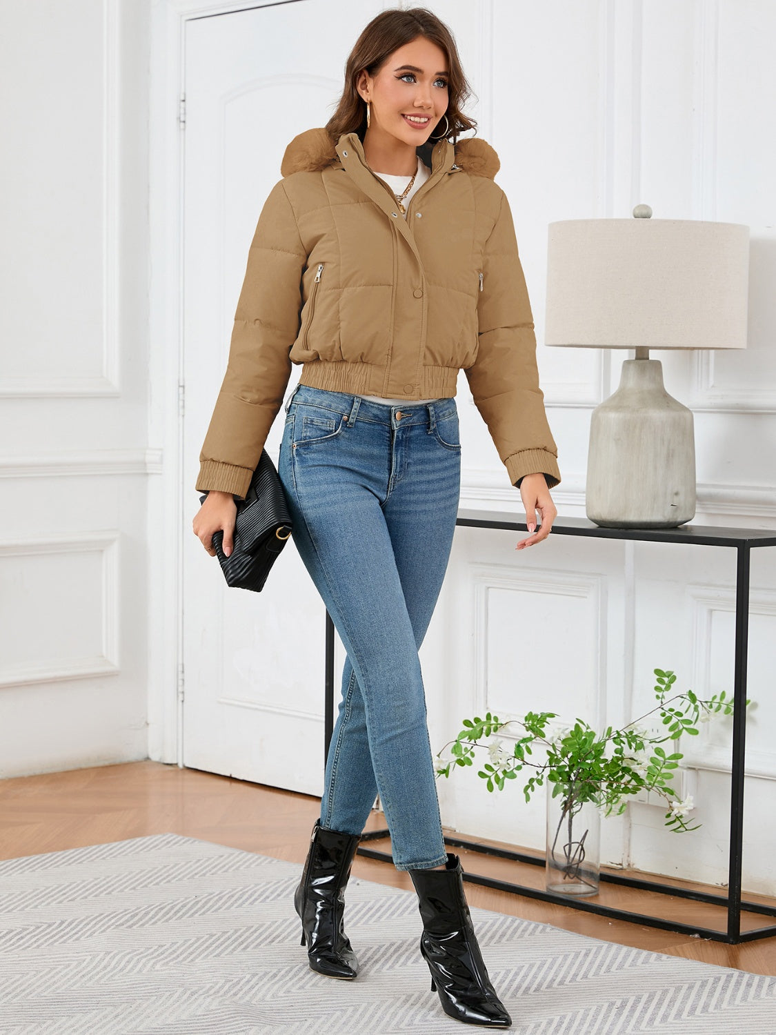 Camel puffer jacket with faux fur trim, cropped length, and zippered pockets.