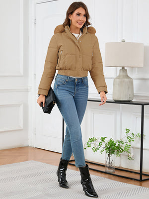 Camel puffer jacket with faux fur trim, cropped length, and zippered pockets.