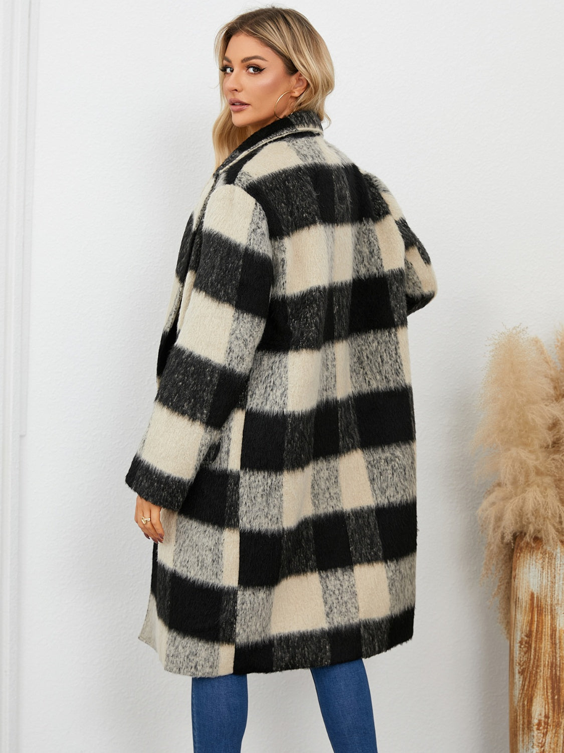 Checked plaid cocoon coat in black and cream with a double-breasted front.
