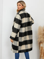Checked plaid cocoon coat in black and cream with a double-breasted front.
