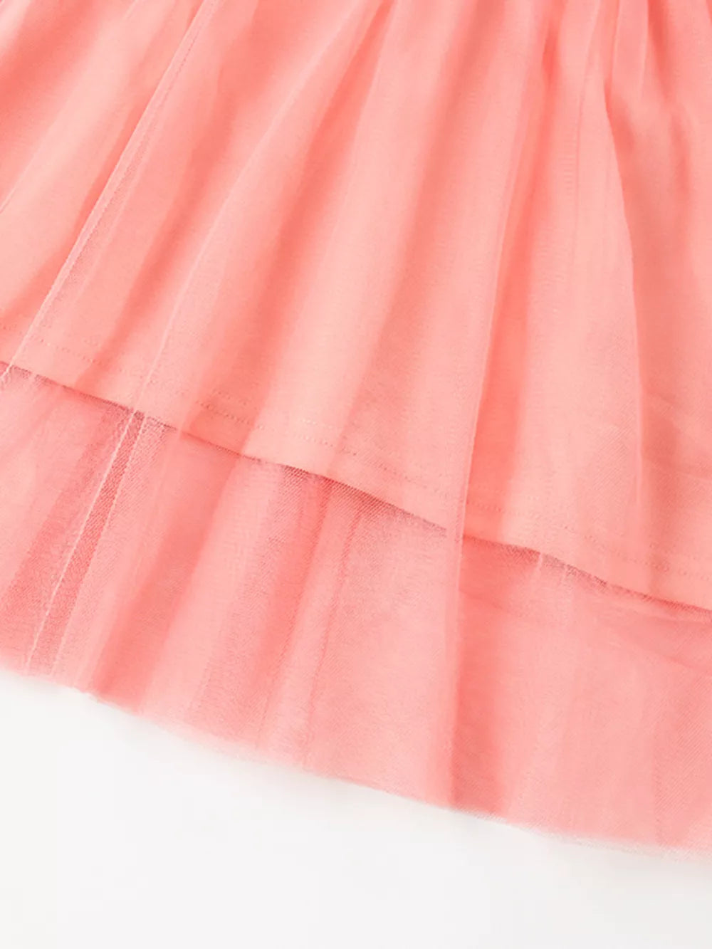 Coral pink baby dress with layered tulle skirt detail